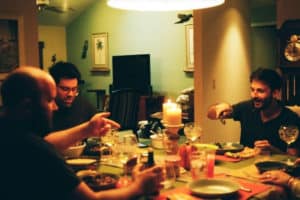 people-sitting-around-a-table-with-food