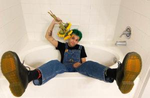 man-laying-in-bathtub-with-legs-strecthed-out
