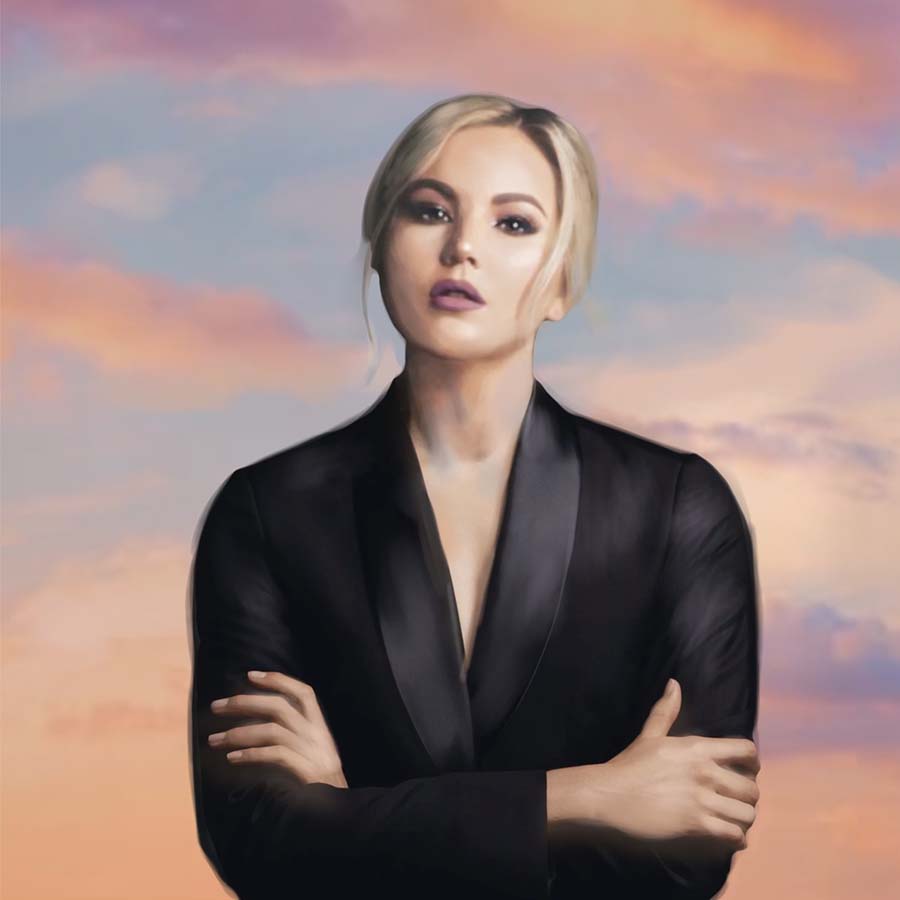 Woman standing in front of sunset clouds with her arms crossed