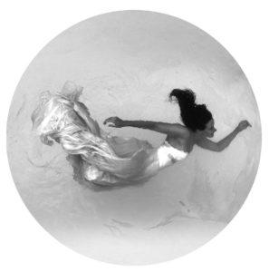 circular-image-of-woman-swimming-through-the-air