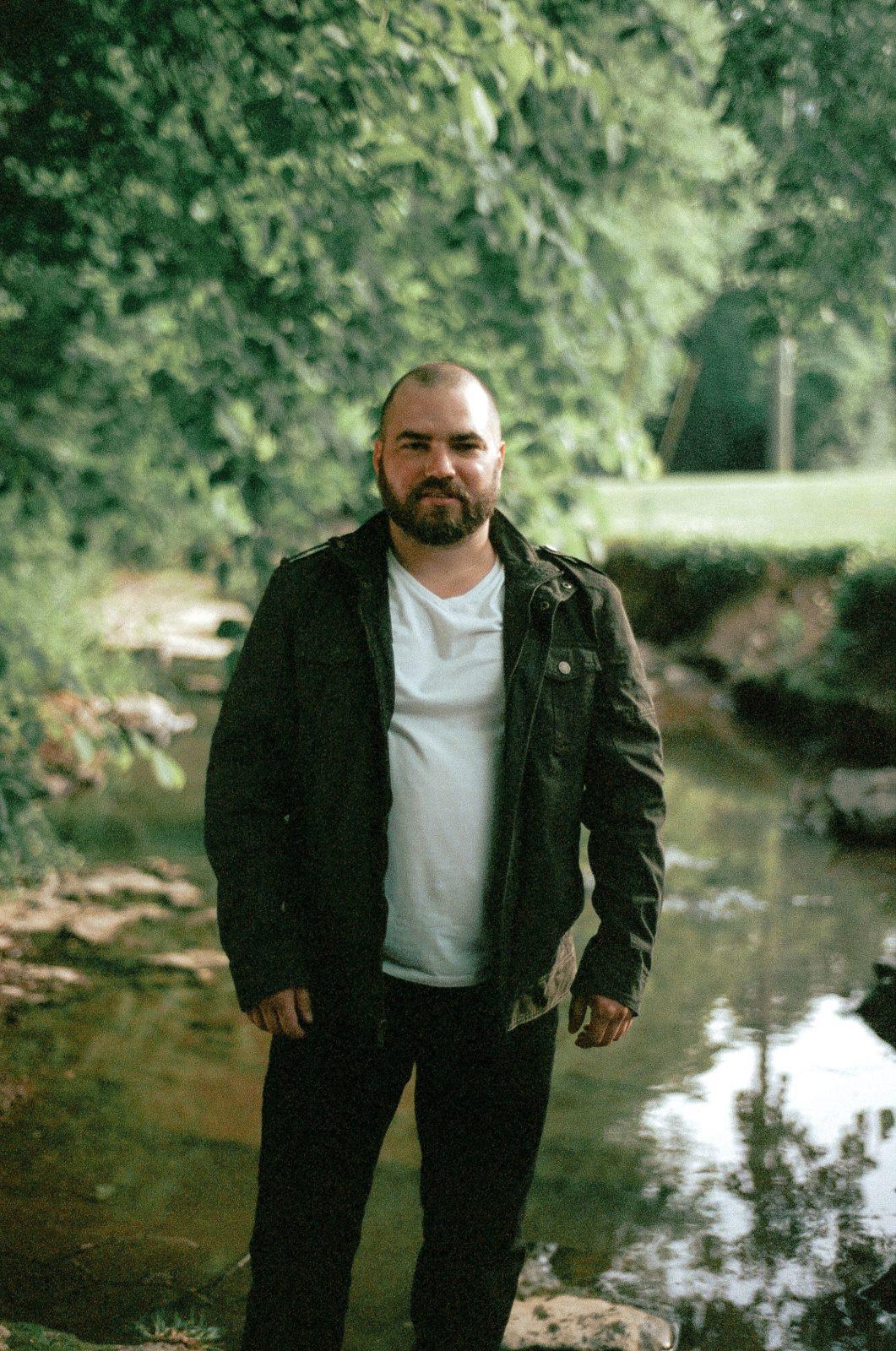 man standing outside in nature