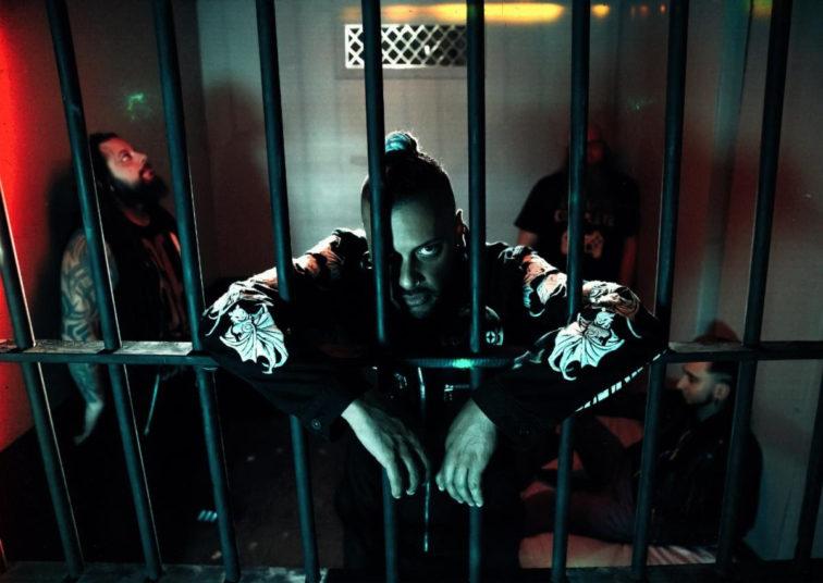 band members looking thru jail cell bars