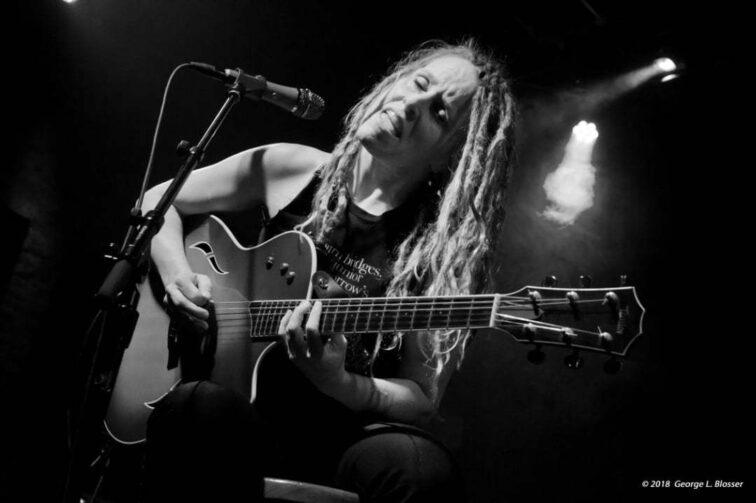 woman playing guitar