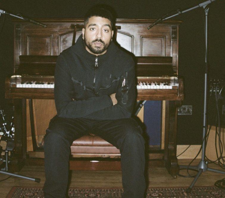man sitting at a piano