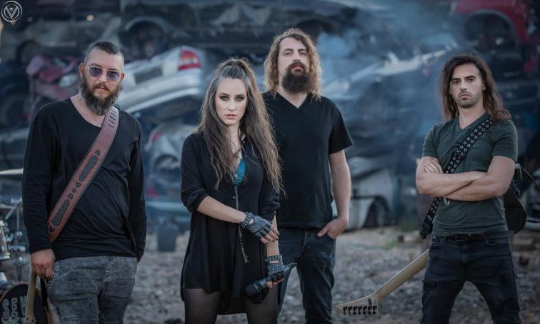 4 band members standing outside
