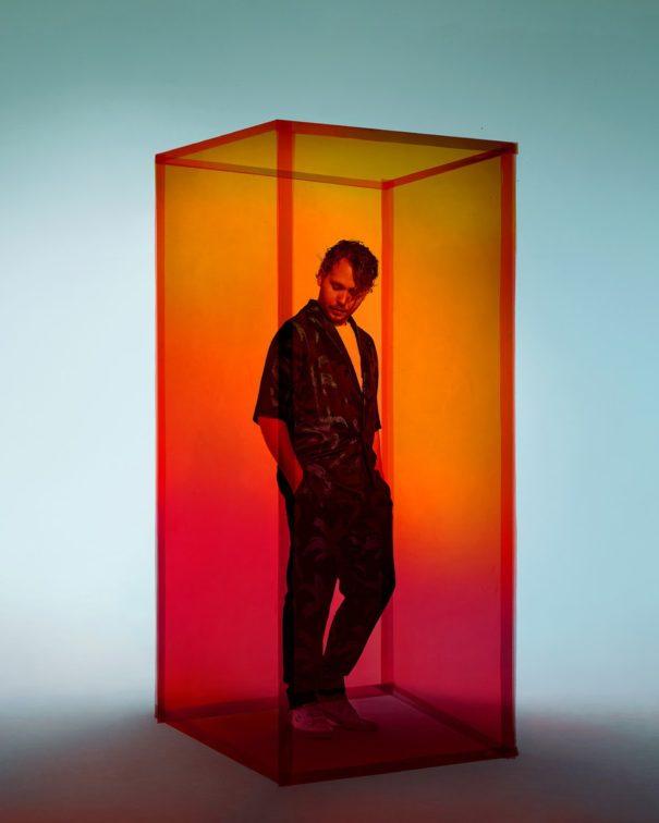 man in a glass box