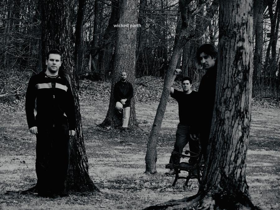 band members standing in the woods