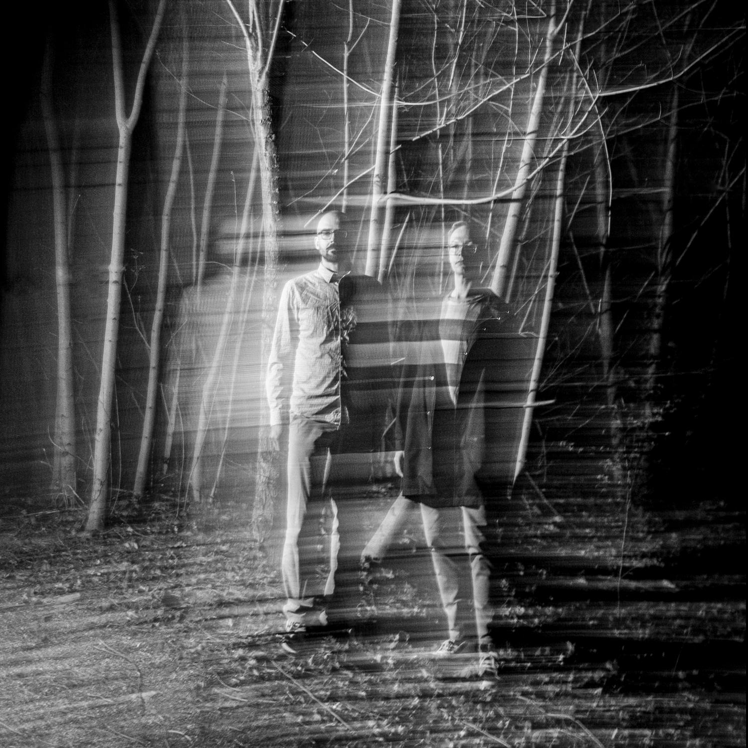 people in the woods at night