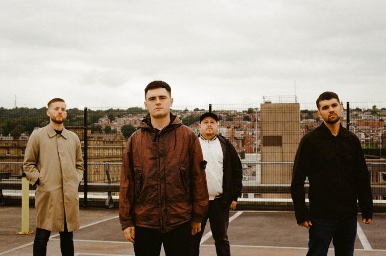 band members standing on a rooftop in a city