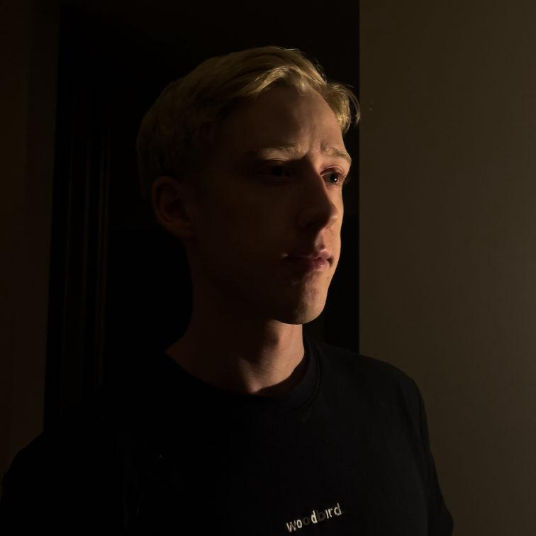 headshot of a person looking to the right