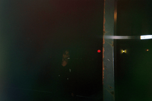 man smoking outside at night