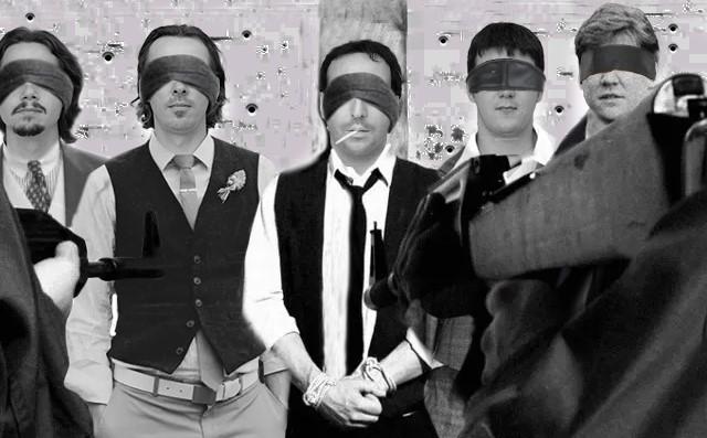 5 men in a row wearing blind folds