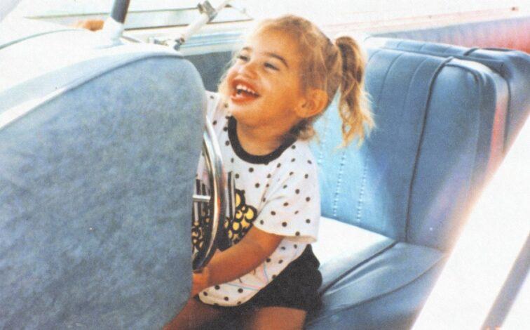 child in the backseat of a car