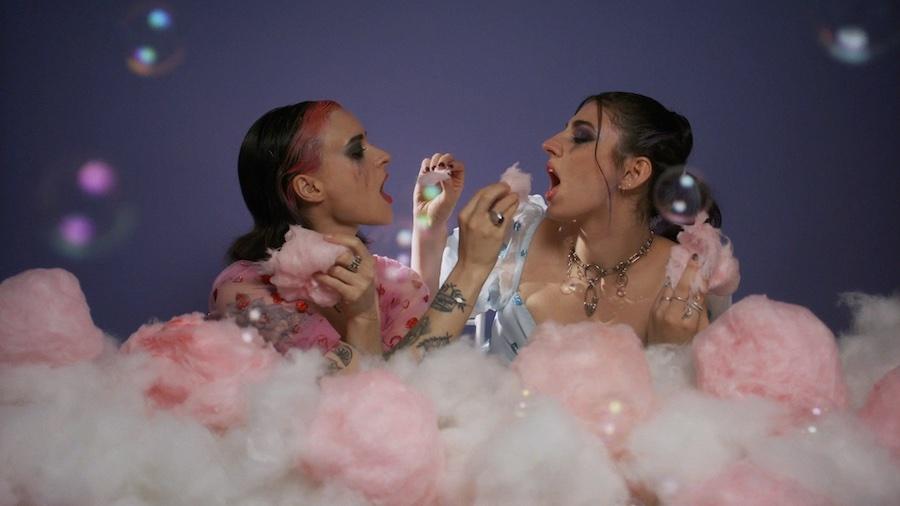 2 girls feeding each other cotton candy