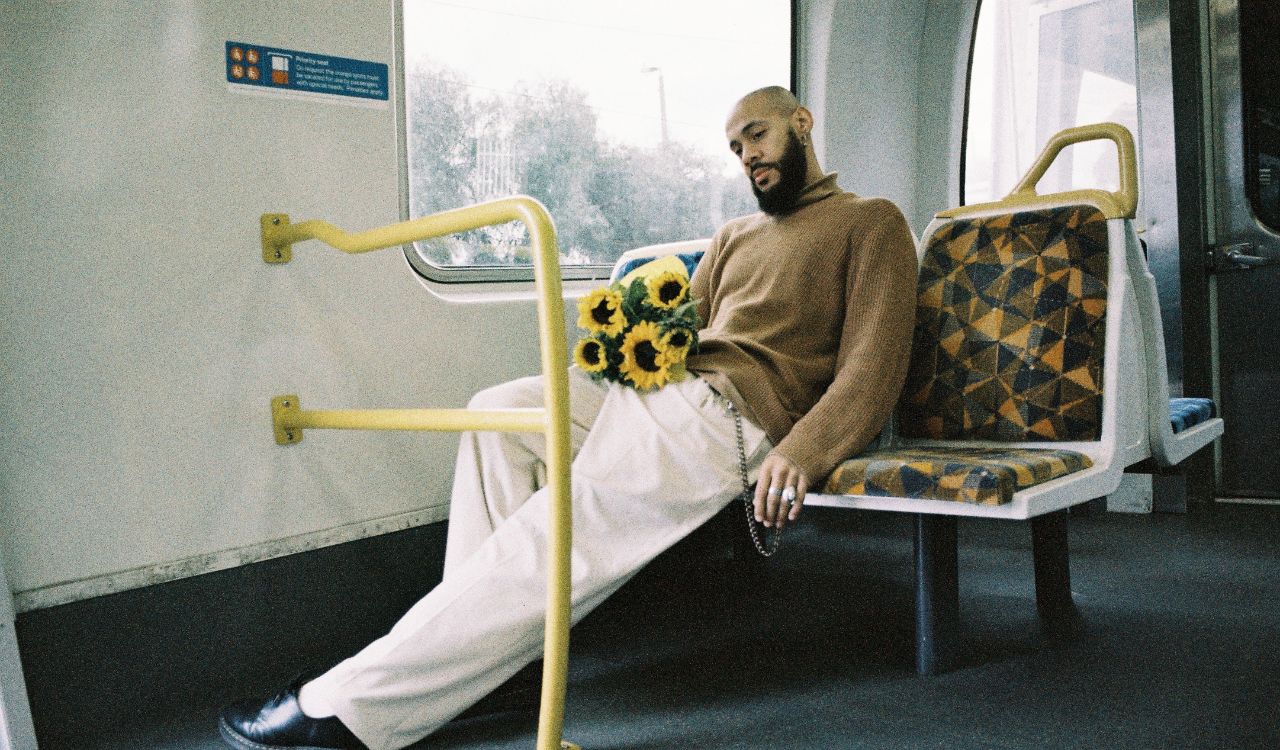 man sitting on an empty bus