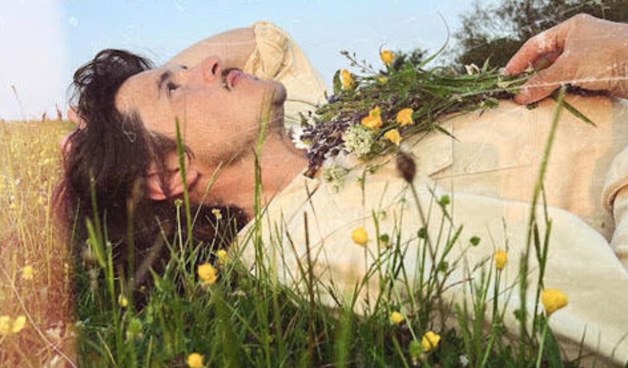 man laying in the grass