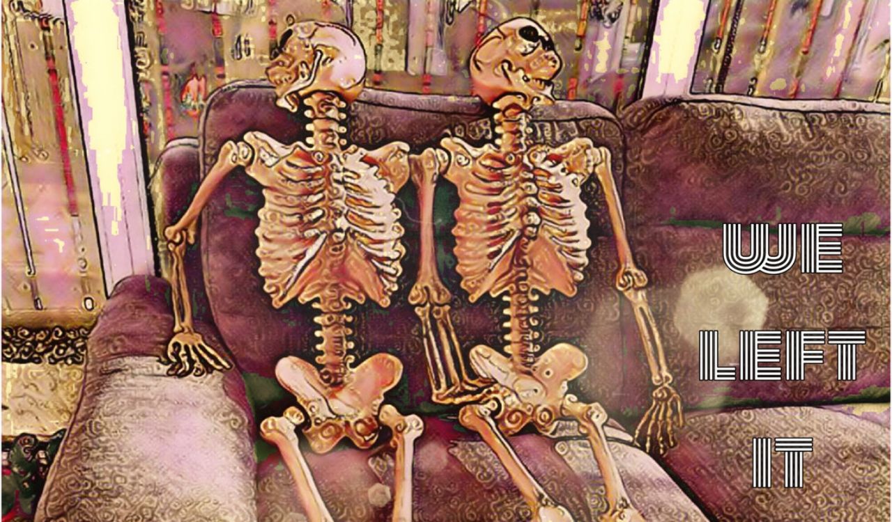 two skeletons laying on a couch