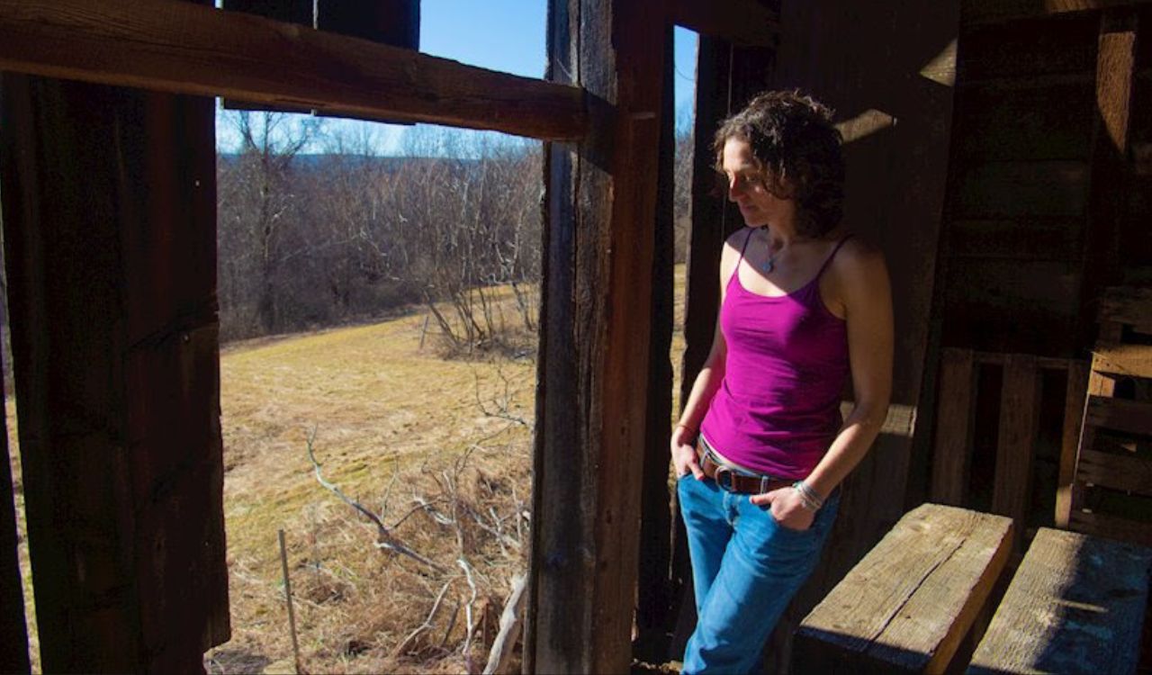 woman standing in a barn