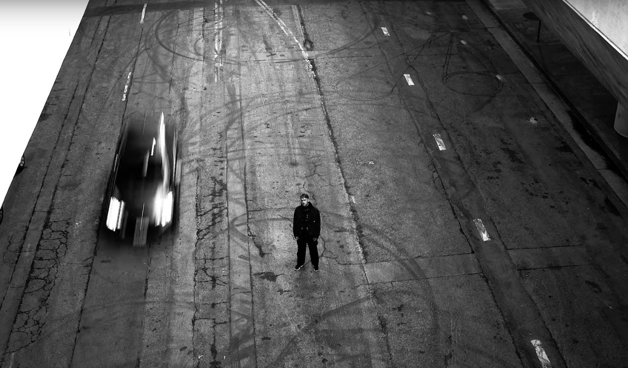 man standing in an empty street