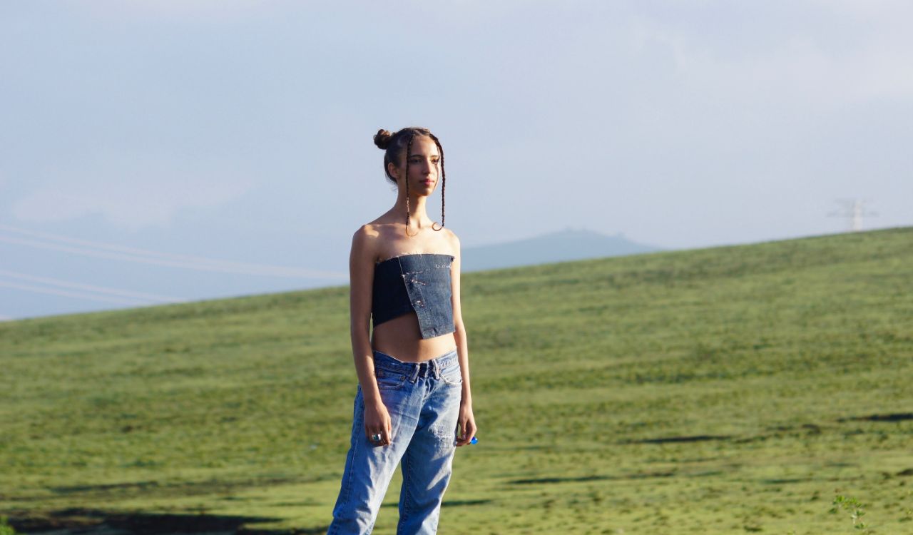 woman standing in an open field