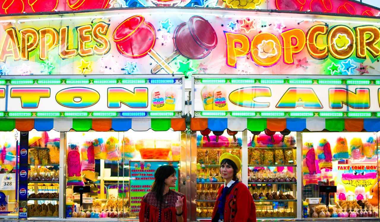 two people outside a candy store