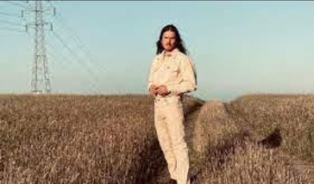 man standing in a field