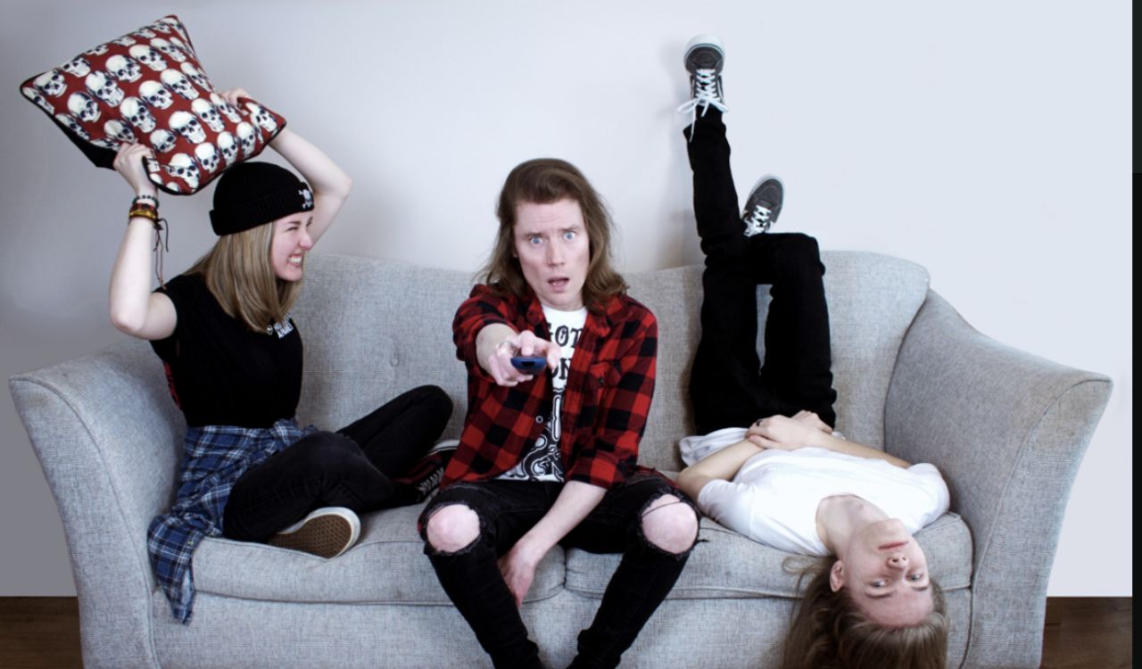 band sitting on a couch