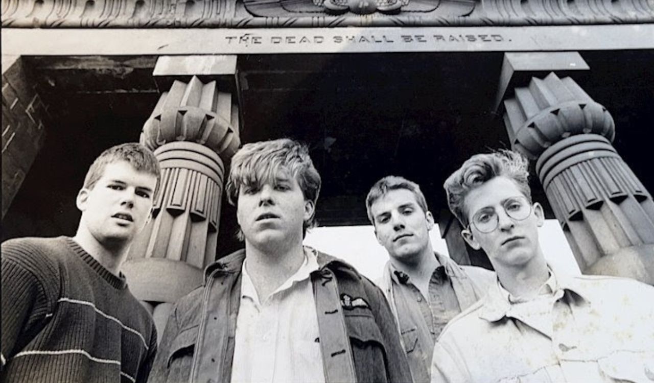 band standing outside in front of a building