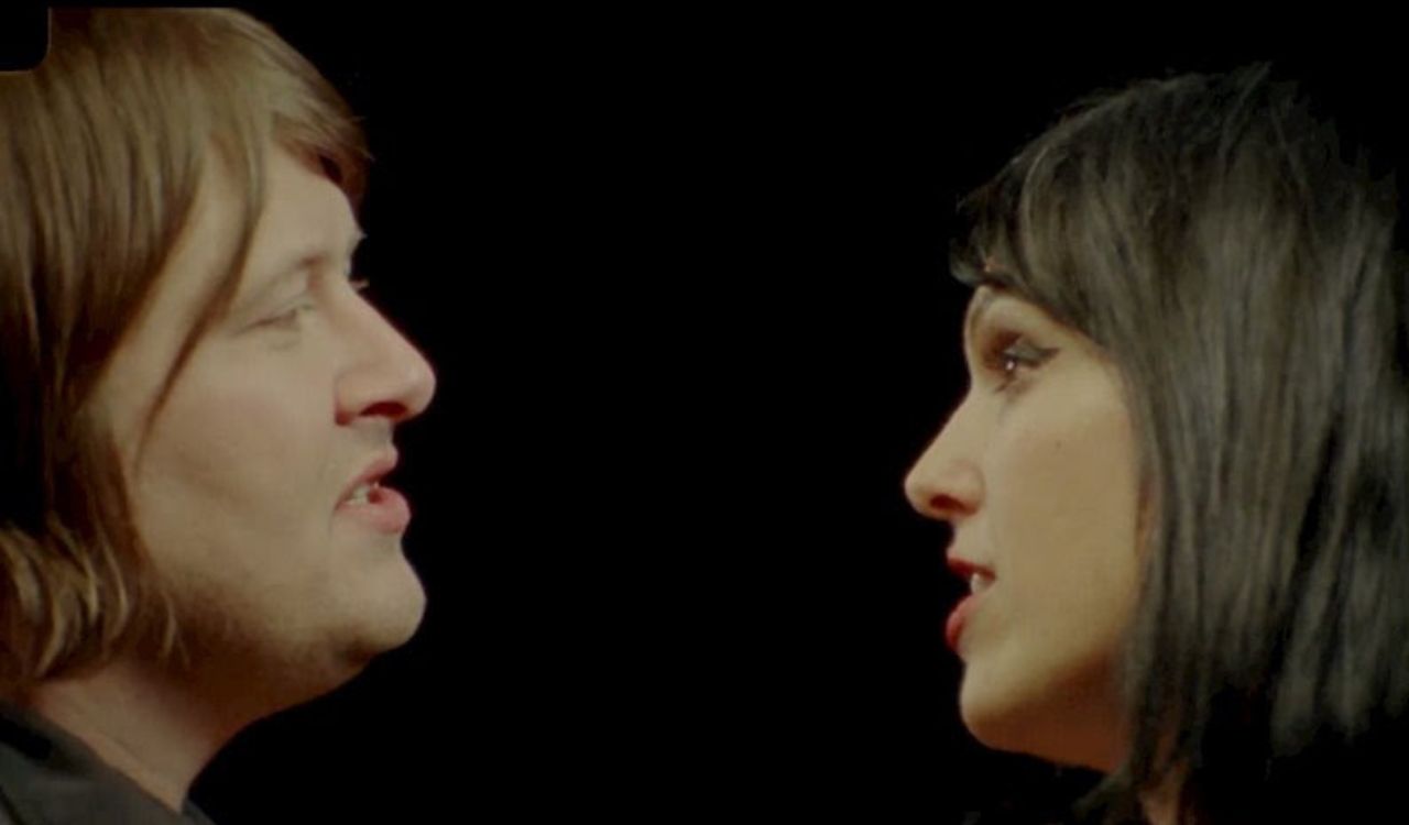 man and woman looking at each other