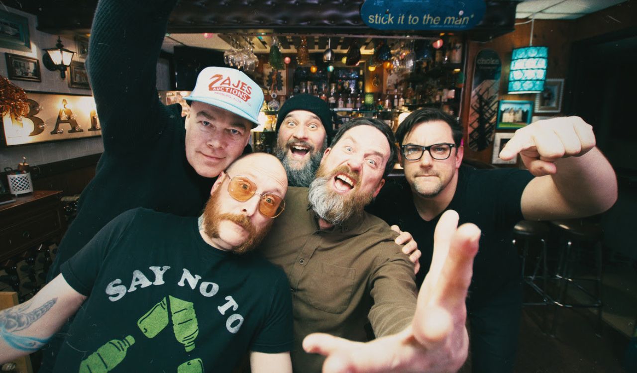 band standing in a pub