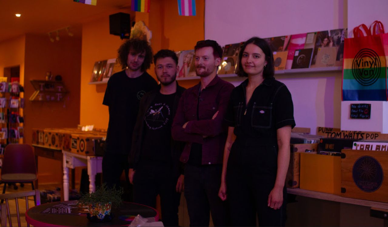 band standing in a room