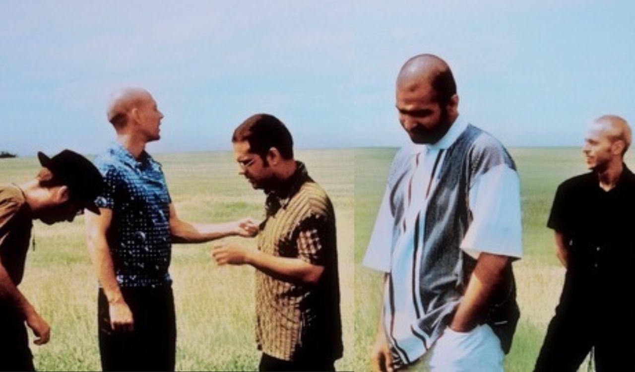 band standing in an open field