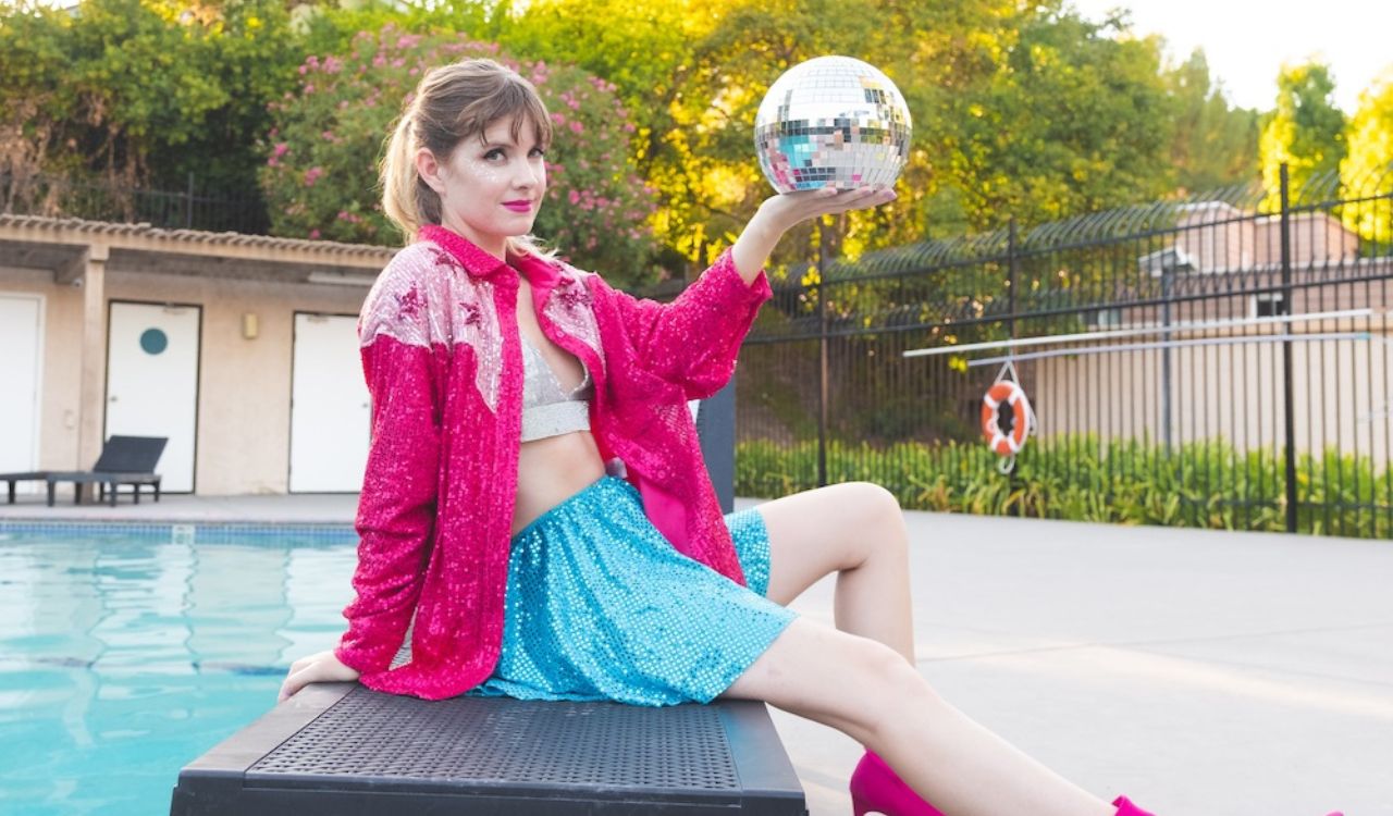 woman sitting on a bench holding a ball