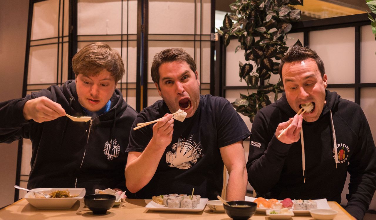 band sitting at a table in a restaurant