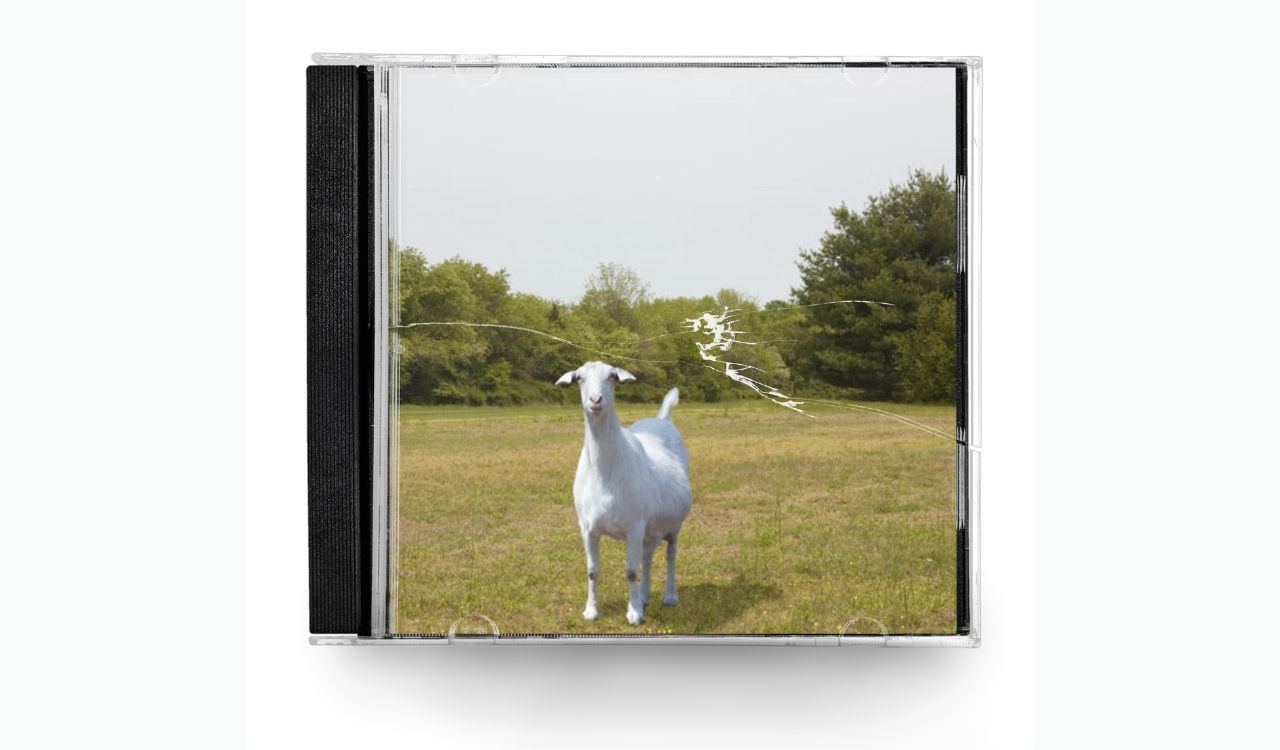 CD cover of a goat n a field