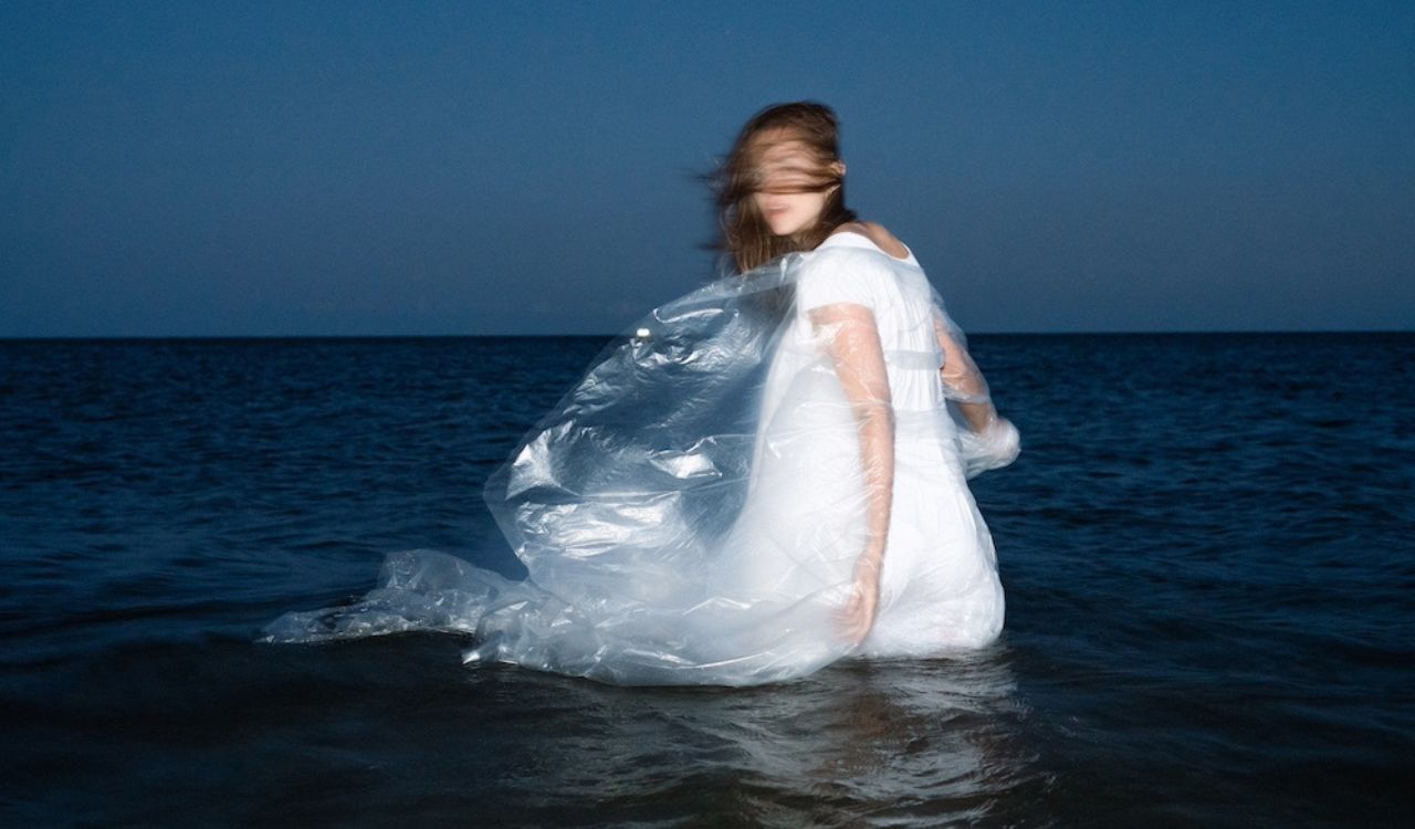 woman standing in deep water