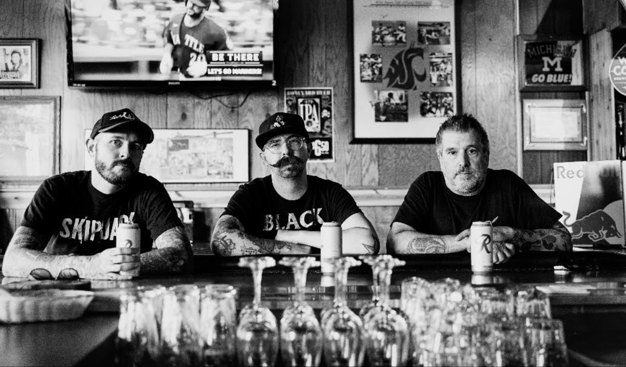 punk band sitting at a table